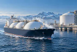 An LNG tanker passes through waters in front of a snowy terminal with snow-capped mountains in the background.