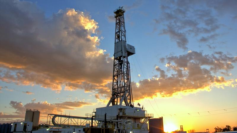 Land drilling rig at sunrise.