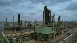 Panoramic view of processing and production installations under a cloudy sky at TOR's existing Tema oil refinery.