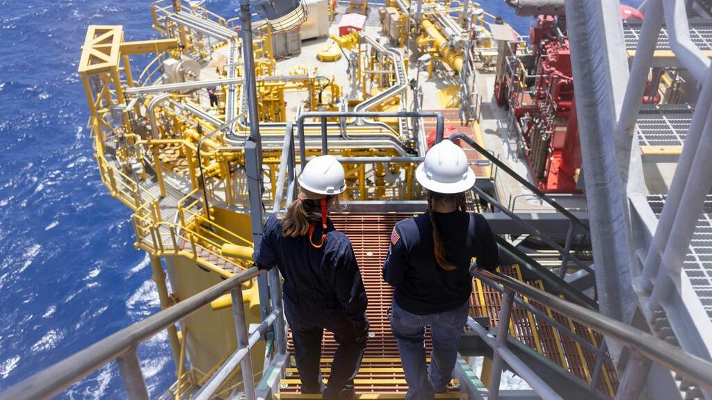 Two workers on stairs at Shell's Whale oil and gas platform in the US Gulf of Mexico