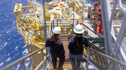 Two workers on stairs at Shell's Whale oil and gas platform in the US Gulf of Mexico